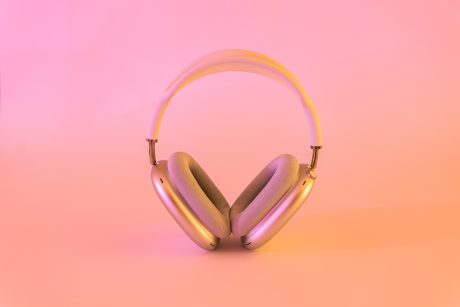 Image of headphones on  a pink background